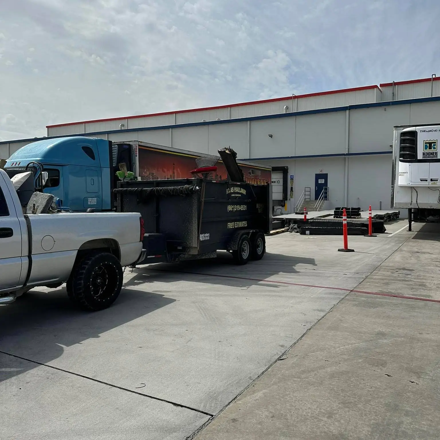 Rojas Junk Removal truck at job site